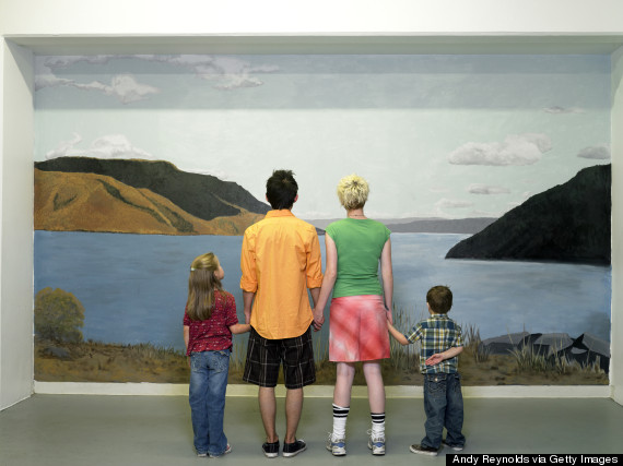 Family looking at nature mural